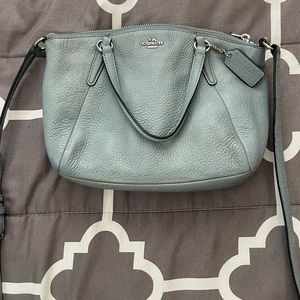 Coach crossbody bag. Baby blue color with silver brand details. Leather.